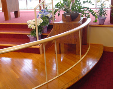 Custom painted steel communion rail in church